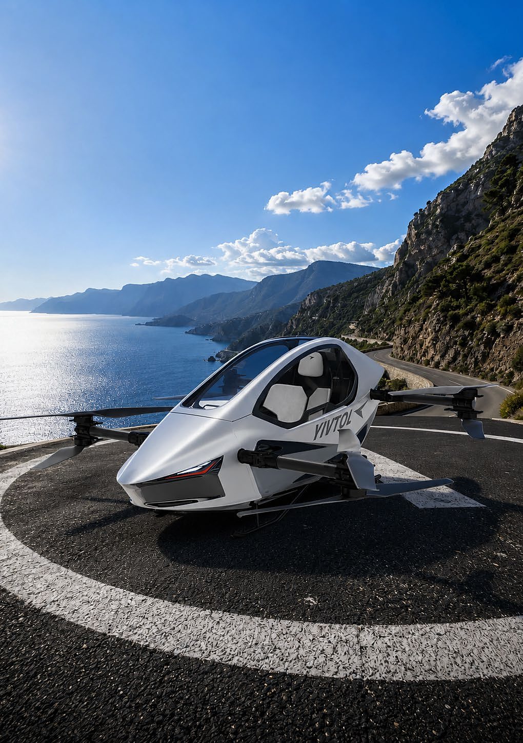 A white S-ZERO parked on a coastal road pad above the sea